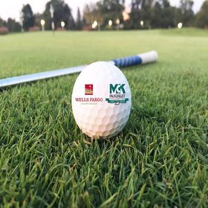 Close-up shot of golf ball with McKinley Building branding/logo